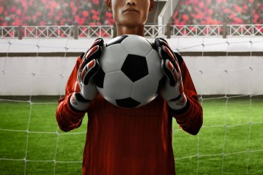 Futbol topu tutan futbol kalecisi