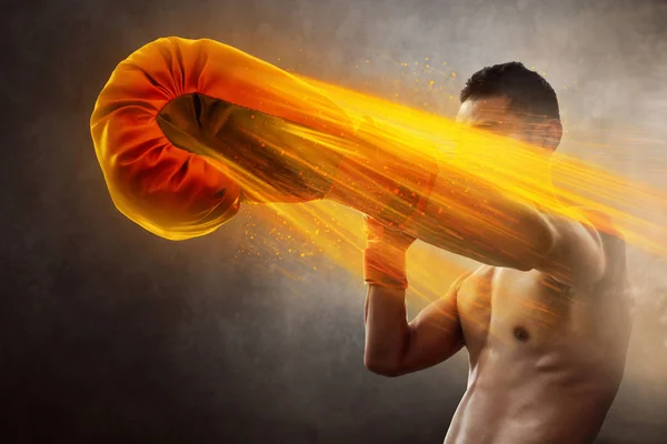 Male boxer training punching