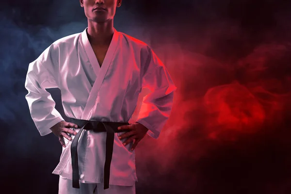 Karate martial arts fighter on dark background