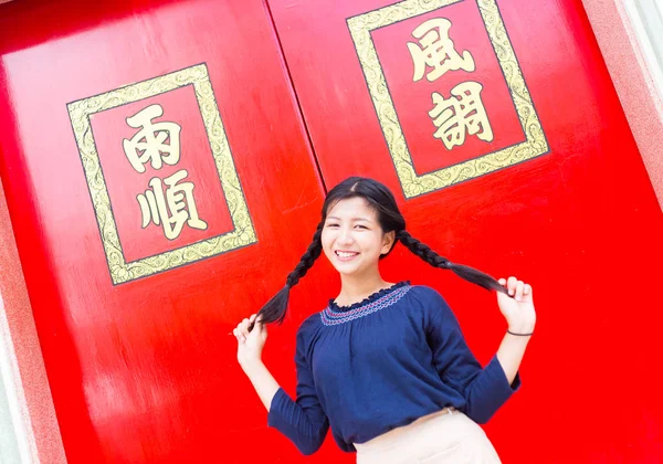 Happy and smile asian teenage. Asian girl enjoy at China tower.