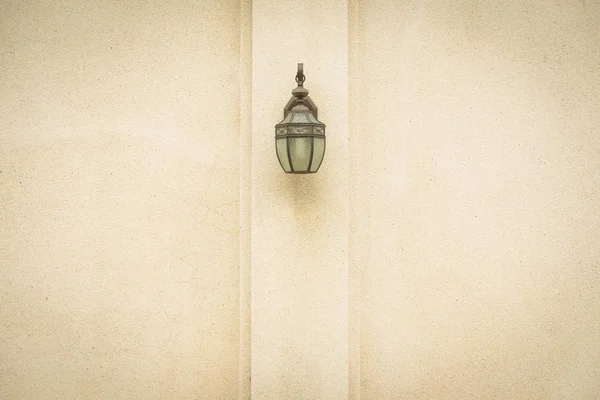 Lamp on brown wall. — Stock Photo, Image