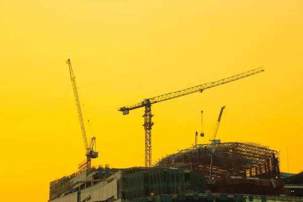 Construction cranes of tall buildings — Stock Photo, Image