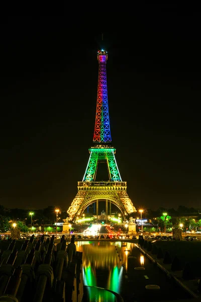 stock image Tour Eiffel colored at summer night clear sky