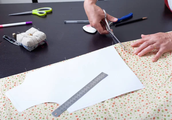 Dressmaker at work, building patterns, hands, modeling, measuring, sewing machine — Stock Photo, Image