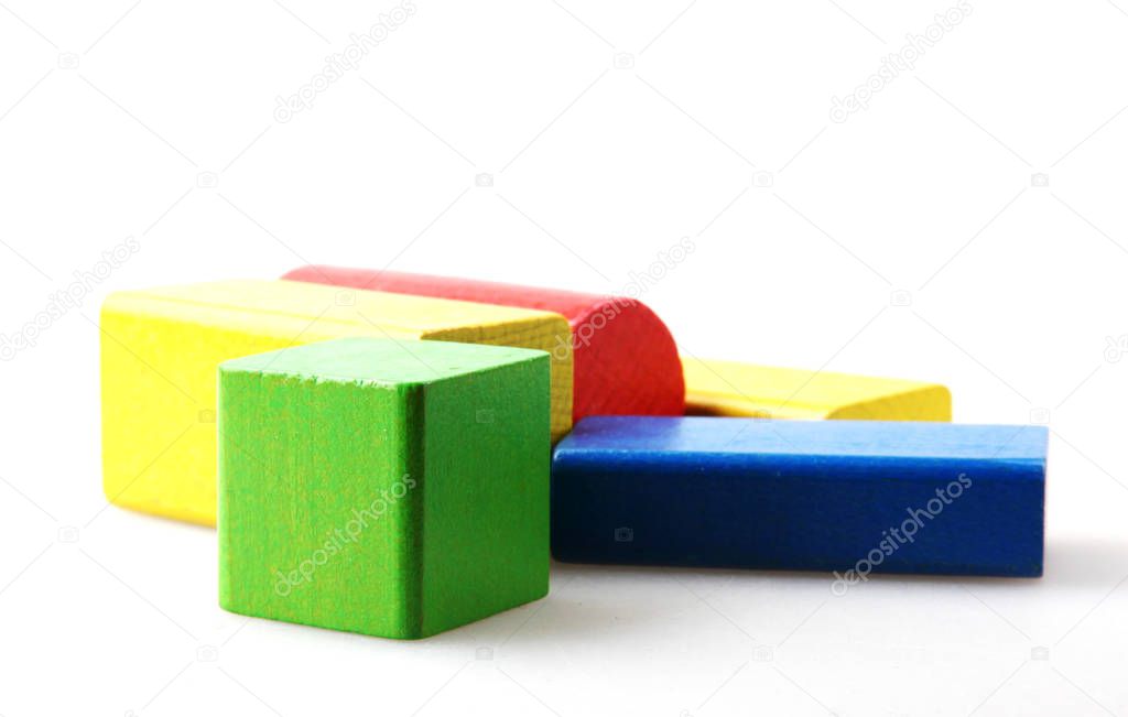 Studio Shot Of Colorful Toy Blocks Against White Background