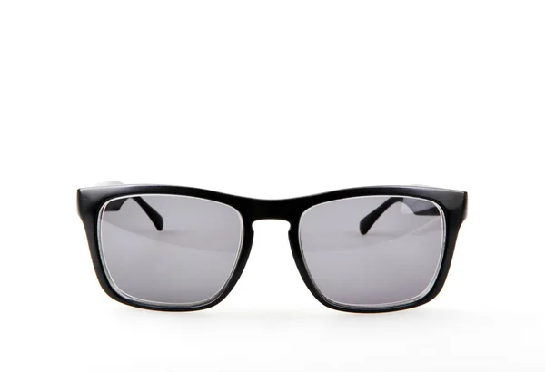 Nahaufnahme Einer Schwarzen Sonnenbrille Vor Weißem Hintergrund — Stockfoto