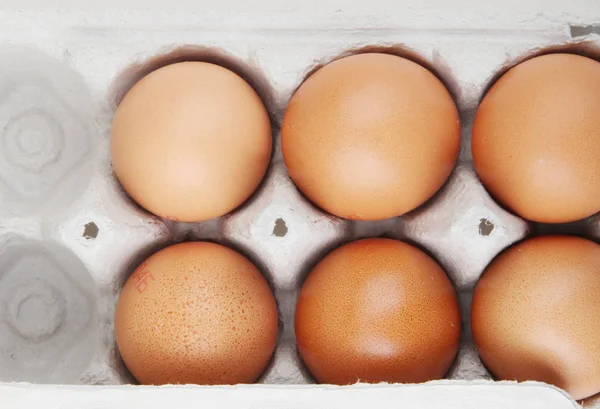 Close-Up Of Brown Eggs In Carton