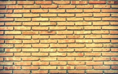 İğrenç sarı eski tuğla duvar dokusu arkaplanı ve yaştan sonra bozulma