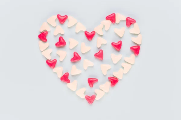 Valentines day background pastel hearts on blue wooden backgroun — Stock Photo, Image