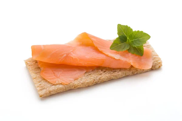 Bread with fresh salmon fillet isolated on white background, top — Stock Photo, Image