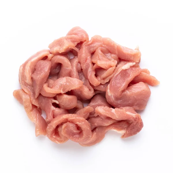 Filé de frango cru. Pequenos pedaços de carne isolados em branco. — Fotografia de Stock