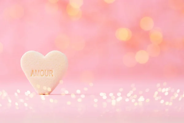 Pastel colored candy hearts in a bokeh background. — Stock Photo, Image