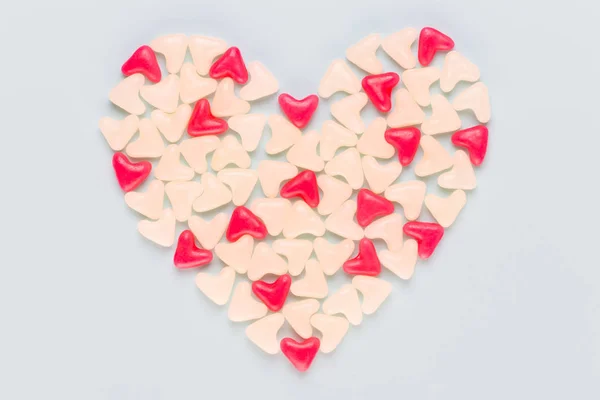 Valentines day background pastel hearts on blue wooden backgroun