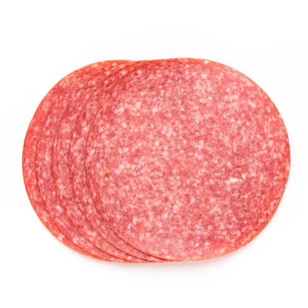 Fette di salame su sfondo bianco. — Foto Stock