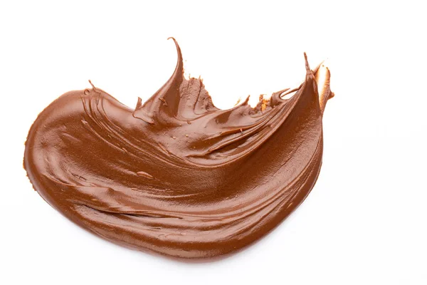 Crema de chocolate aislada sobre fondo blanco. Puesta plana. — Foto de Stock