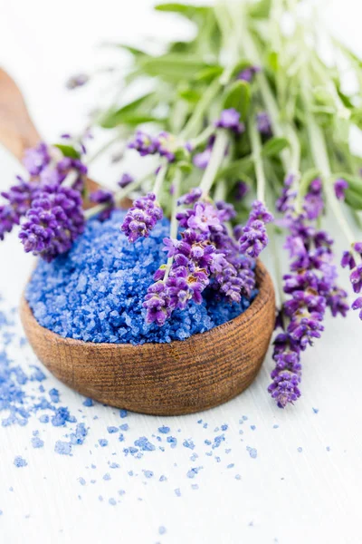 Essential lavender salt with flowers top view. Royalty Free Stock Photos