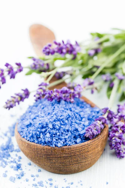 Essential lavender salt with flowers top view. Stock Photo