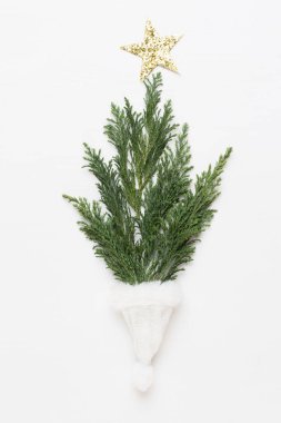 Noel tebrik kartı. Beyaz arka planda çam süslemesi. Ne?