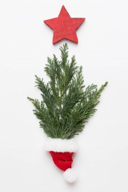 Noel tebrik kartı. Beyaz arka planda çam süslemesi. Ne?