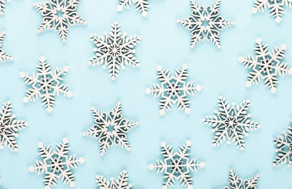 Christmas background. White snow decorations on a pink backgroun — Stock Photo, Image
