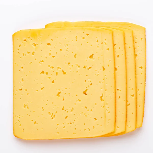 Řez sýra na bílém pozadí. — Stock fotografie