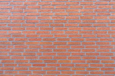 Bir arkaplan resminde tuğla duvar.