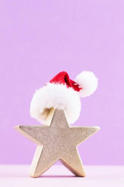 Noel yıldızı, pastel renkli arka planda dekor. Noel veya