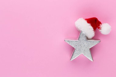 Noel yıldızı, pastel renkli arka planda dekor. Noel veya