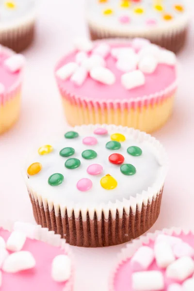 Multiple Colorful Nicely Decorated Muffins Pink Background Top View — Stock Photo, Image