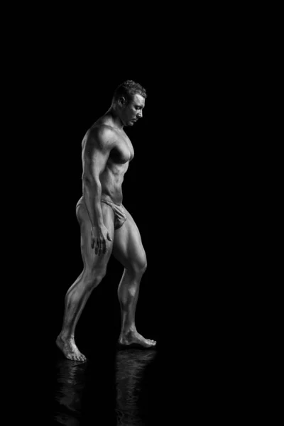 Black and white portrait Male bodybuilder posing on a white background. Photo made in the style of \