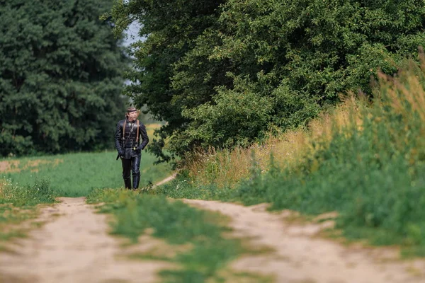 Man actor in the historical leather costume of a knight from the fantasy games