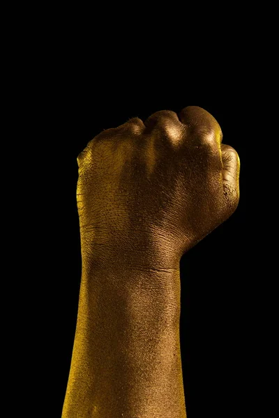 Golden hand and gesture on a black background