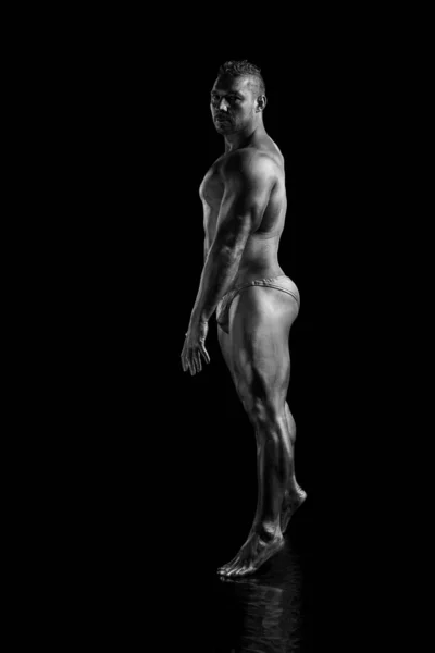 Black and white portrait Male bodybuilder posing on a white background. Photo made in the style of 