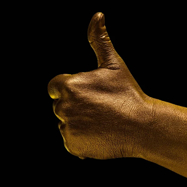 Golden hand and gesture on a black background