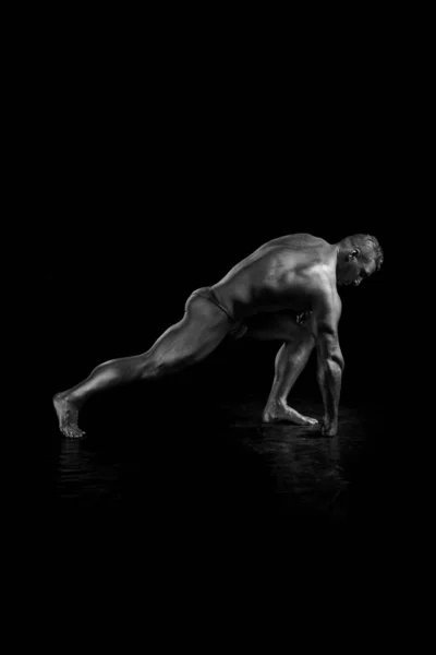 Black and white portrait Male bodybuilder posing on a white background. Photo made in the style of \