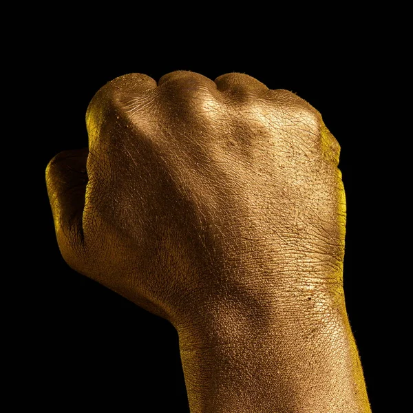 Golden hand and gesture on a black background