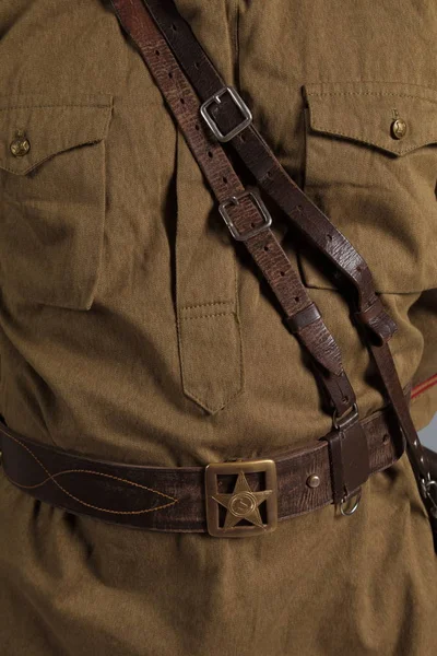 detail of the uniform of an ordinary soldier of the Russian army during the First World War, on a white background in the studio
