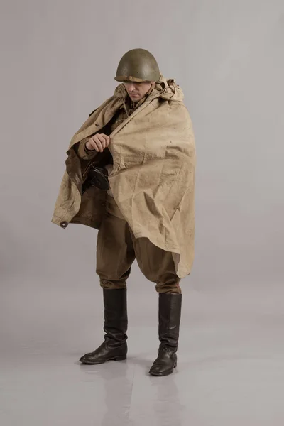 male actor movie in the role in the winter military uniform of an old soldier, the period 1942, the Second World War, posing