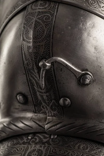 medieval knightly Italian helmet Armet, period of the 16th century, on a white background.