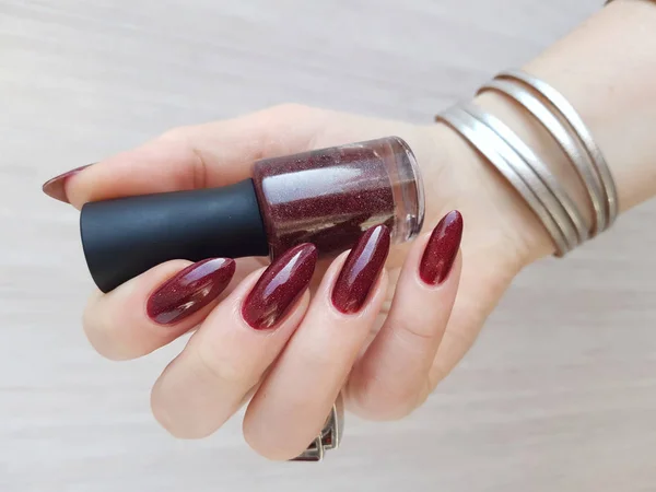 close up of female hand with fresh colorful manicure