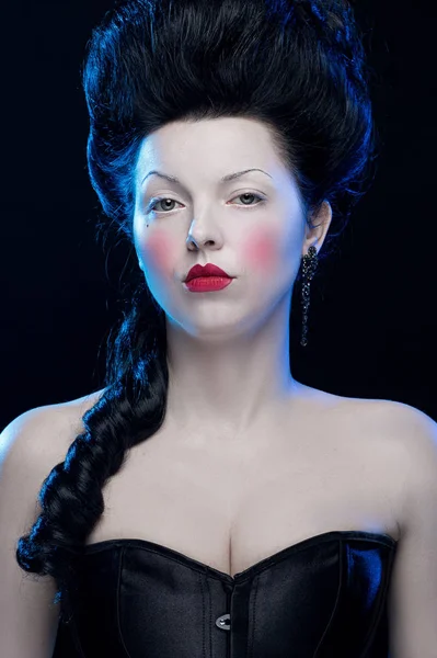 emotional actress brunette woman with pale skin in the role of vampire on black background