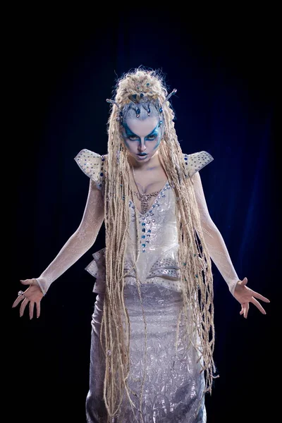 emotional actress woman in makeup and costume of the Snow Queen