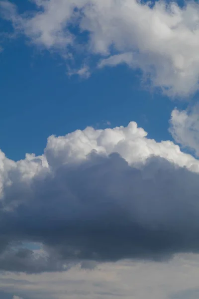 blue sky background with grey clouds