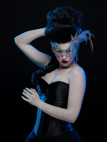 emotional actress brunette woman with pale skin in role of vampire on black background