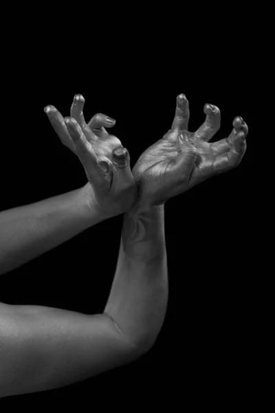 Female hands body-art. Silver skin with a black pattern.