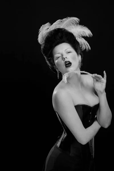 emotional actress brunette woman with pale skin in the role of vampire on black background