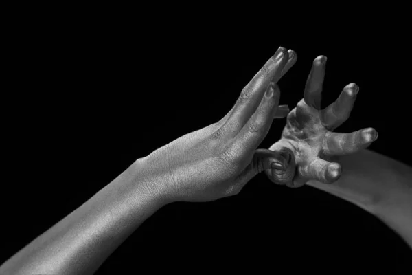 Female hands body-art. Silver skin with a black pattern.