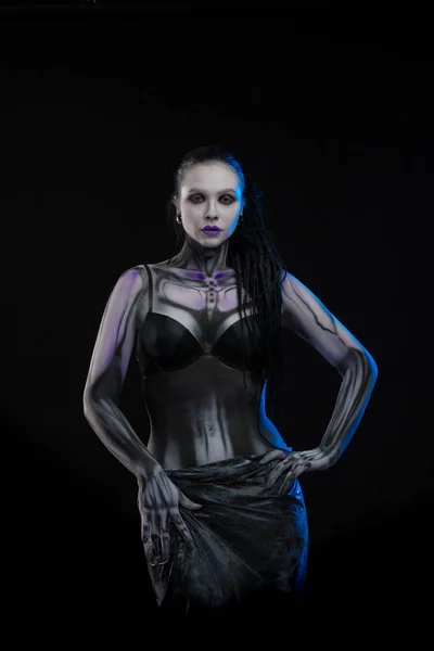 Character for computer game Body painting cyborg, woman with pattern on body on black background