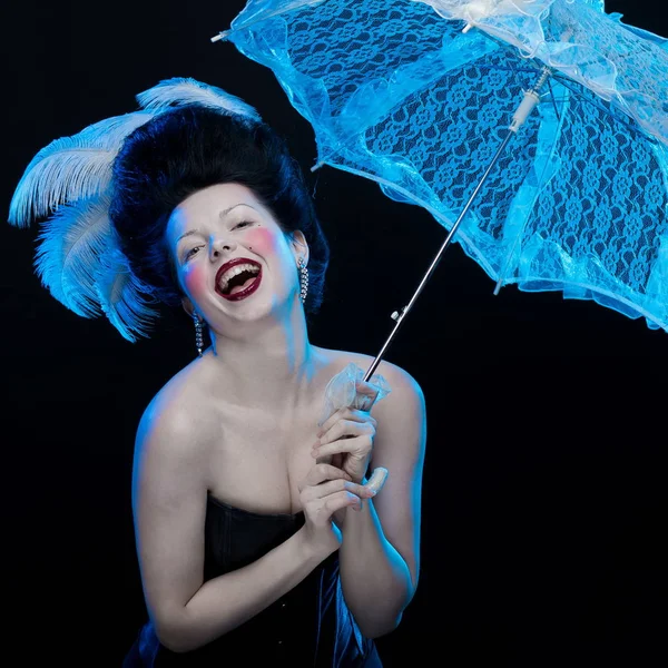 emotional actress brunette woman with pale skin in role of vampire on black background