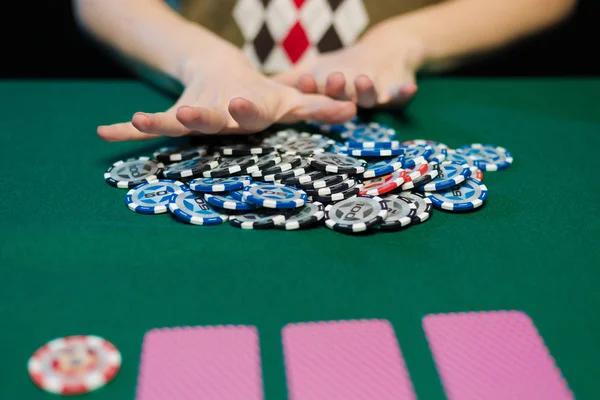 young lady playing solitaire and posing on dark background